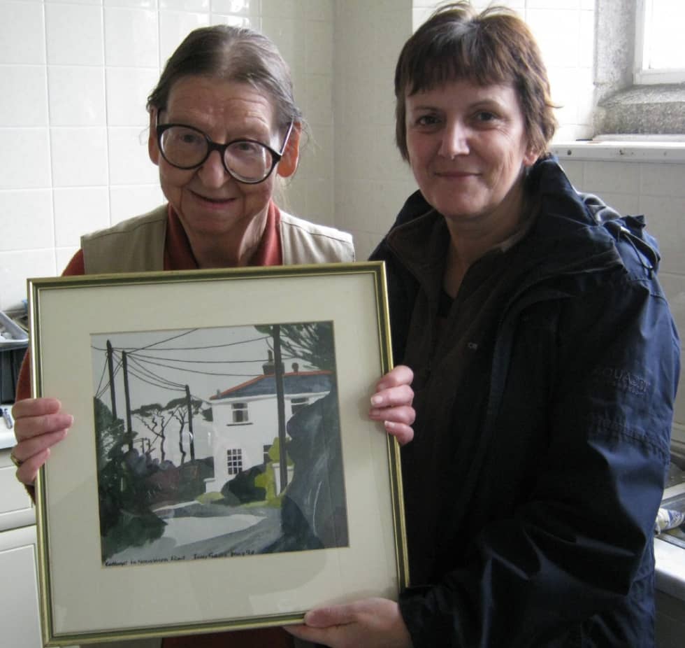 Hilary Giles (left), with Clare Murton, Museum Curator, with the newly acquired watercolour, at the Coffee Morning